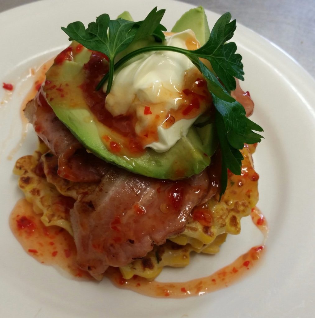 Corn Fritter with bacon, avocado, sour cream and sweet chilli sauce