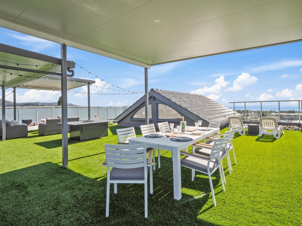 Roof top terrace with spa, dining area, BBQ and outdoor gas fireplace