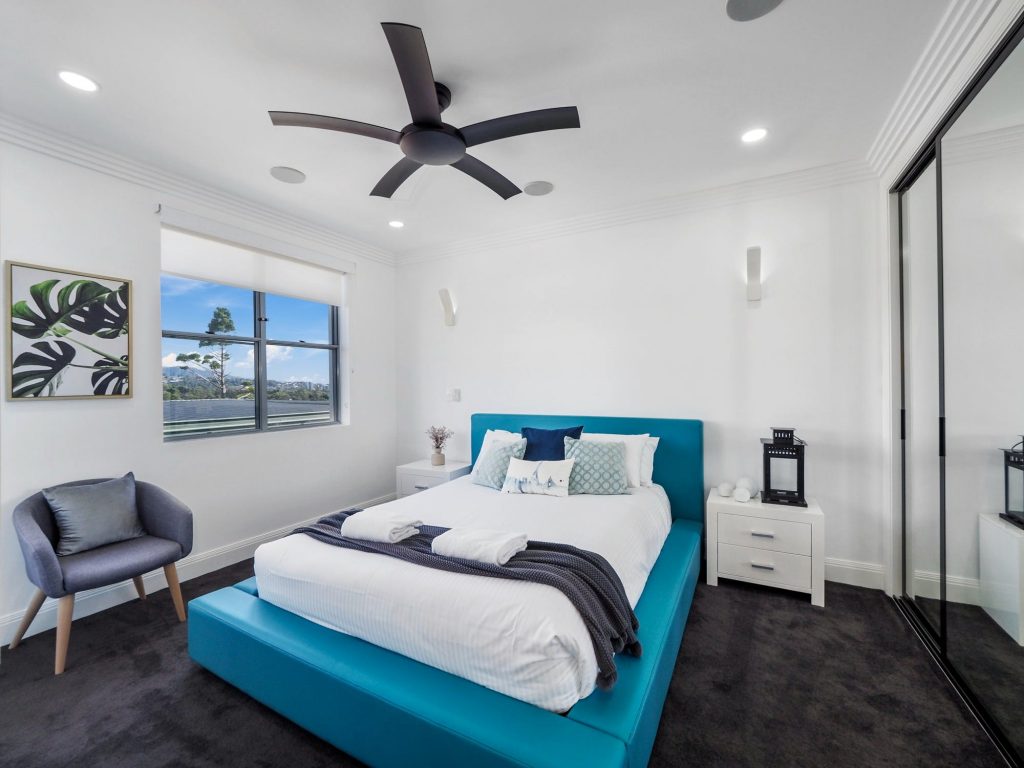 Fourth Bedroom with Queen Bed, Private Balcony, Air-Conditioning, and TV