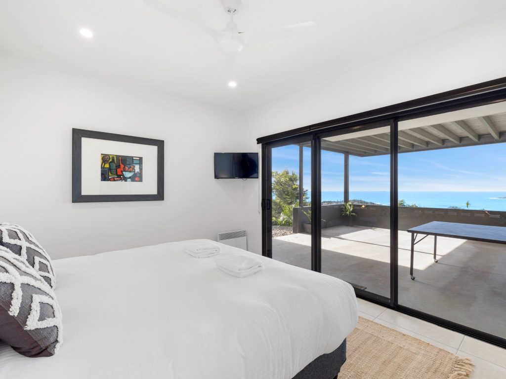 Fourth king bedroom opening to ping pong and ocean views
