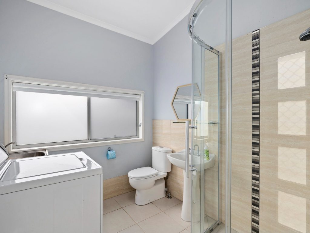 Second bathroom with laundry facilities