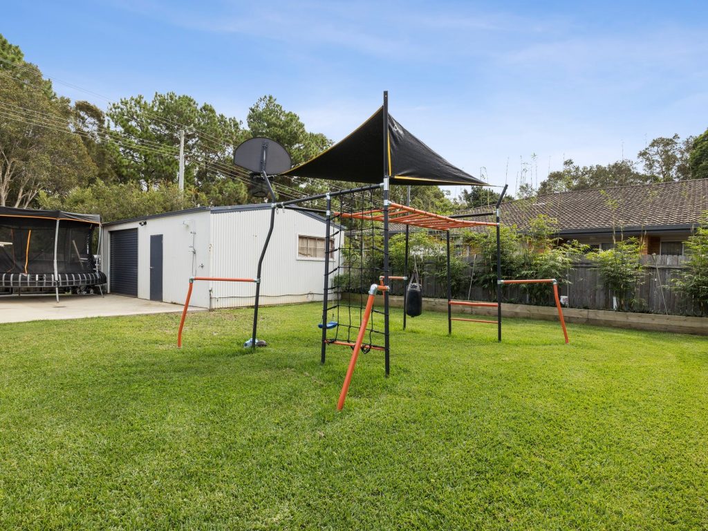 Large backyard with play equipment