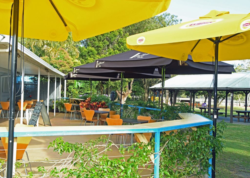 Outdoor courtyard overlooking Coffs Creek at Creekside Cafe at Dolphin Marine Conservation Park
