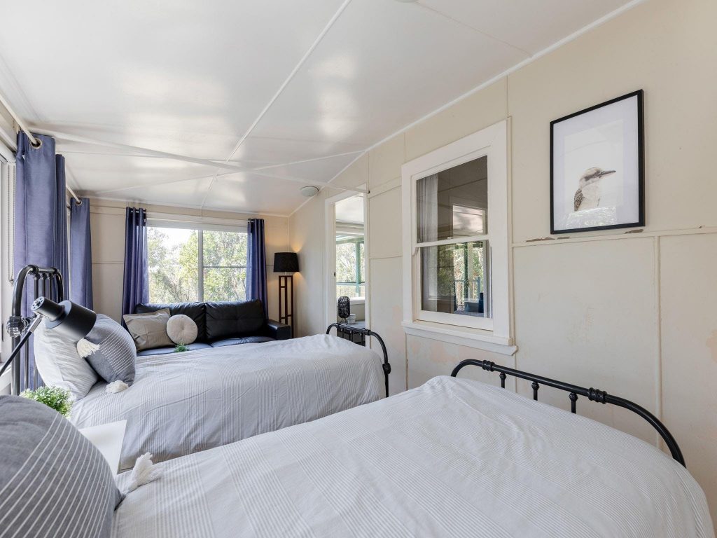 The second bedroom with single beds in Tuckers Rocks Cottage, Bongil Bongil National Park. Photo: