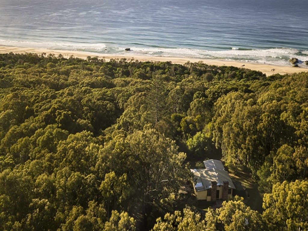 Aerial view of Tuckers Rocks Cottage and bushland and beach surrounds. Photo: John Spencer/DPIE