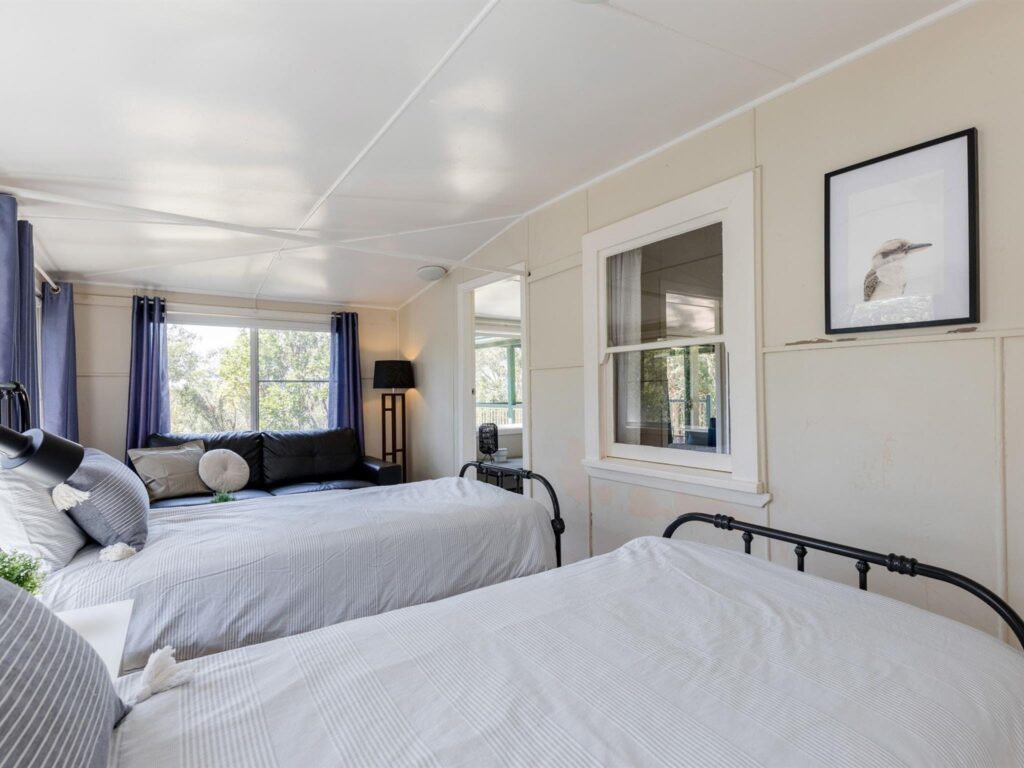 The second bedroom with single beds in Tuckers Rocks Cottage, Bongil Bongil National Park. Photo: