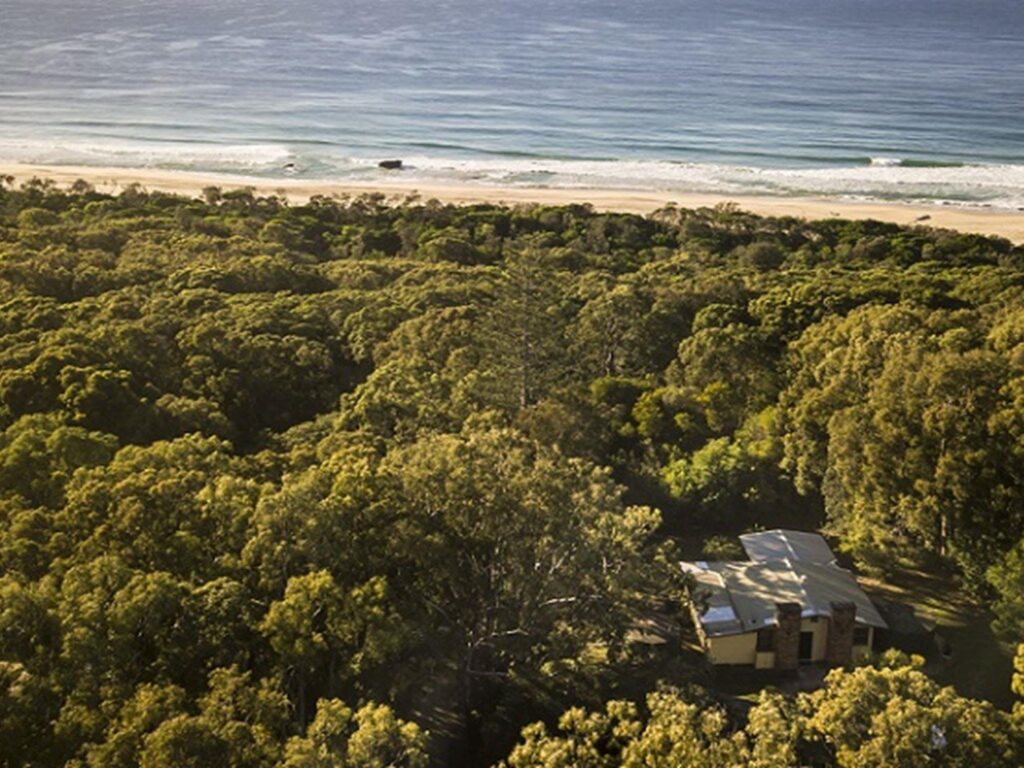 Aerial view of Tuckers Rocks Cottage and bushland and beach surrounds. Photo: John Spencer/DPIE