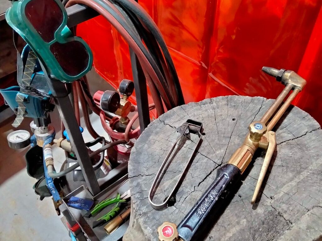 An oxygen/acetylene welding torch, with gas bottle, mask and ignitor