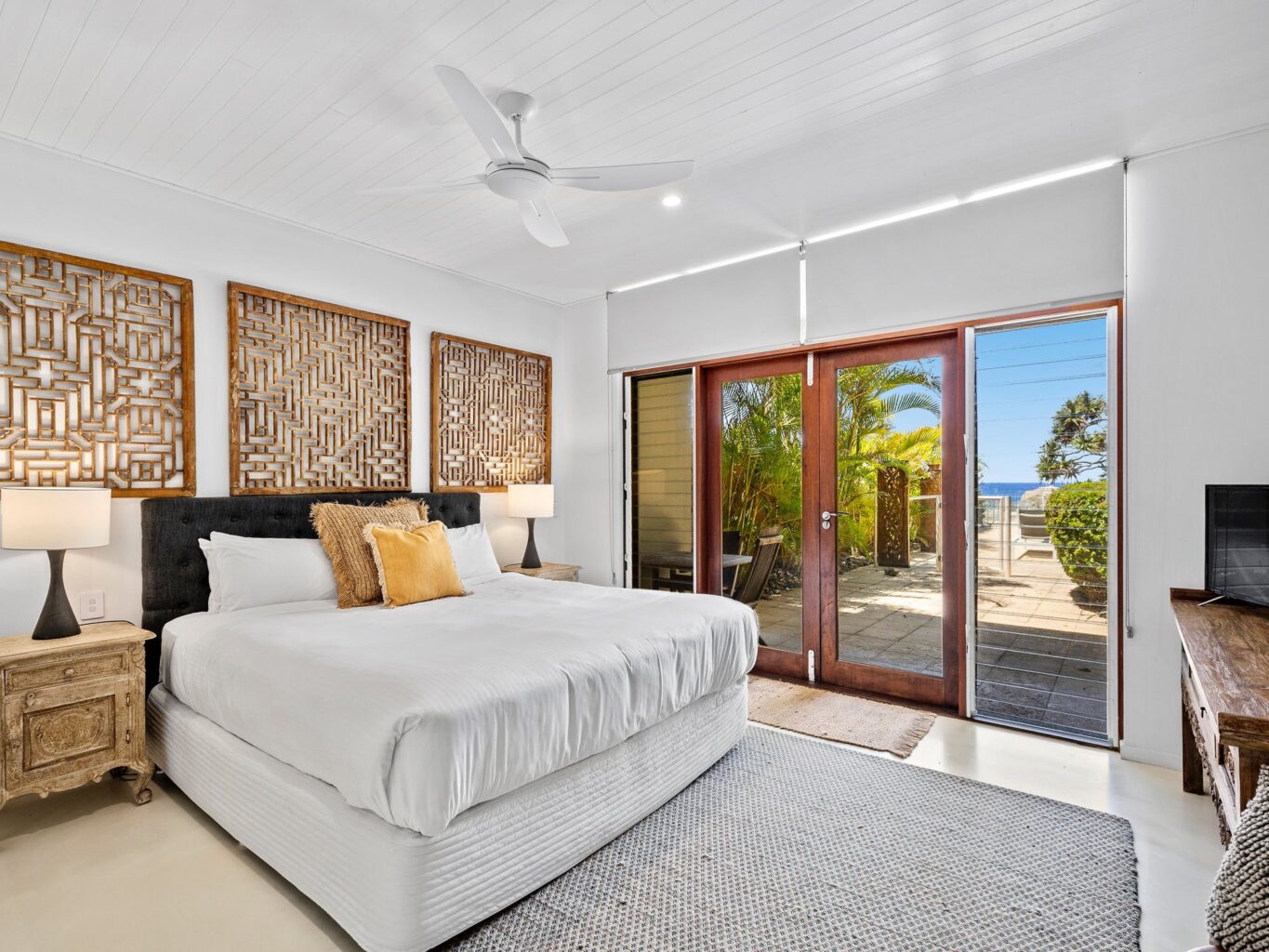 Main bedroom - walk straight out to the pool, hot tub and beach access