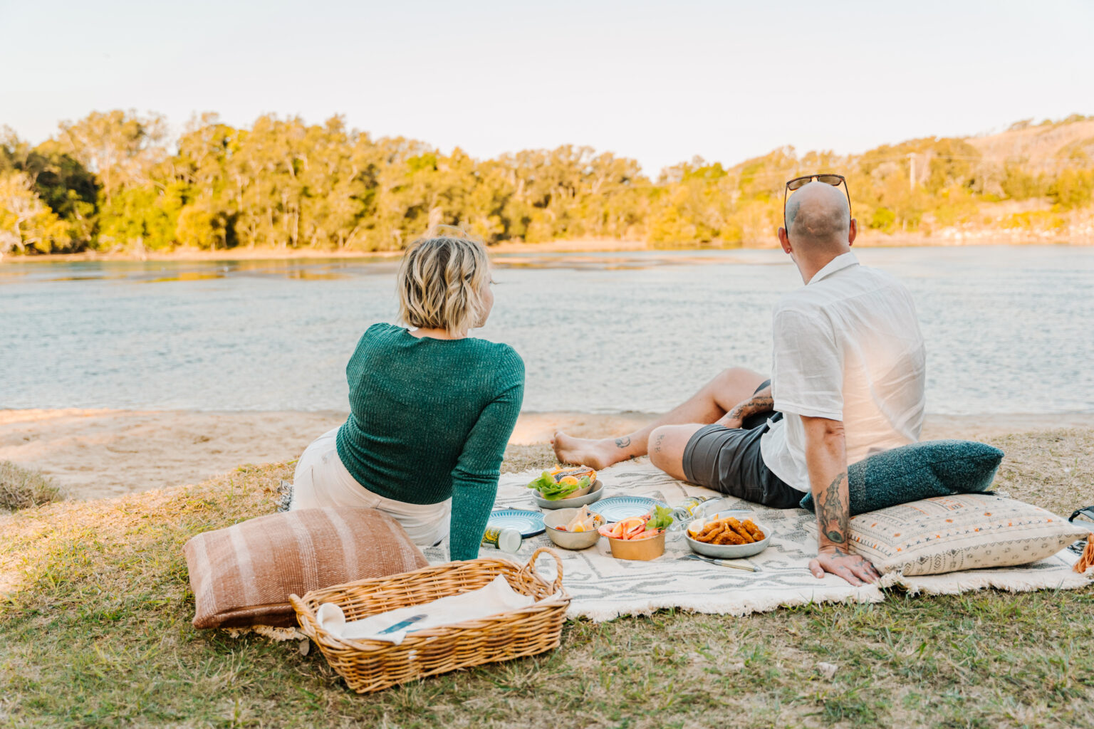 Couple enjoying picnic at Boambee Creek Reserve