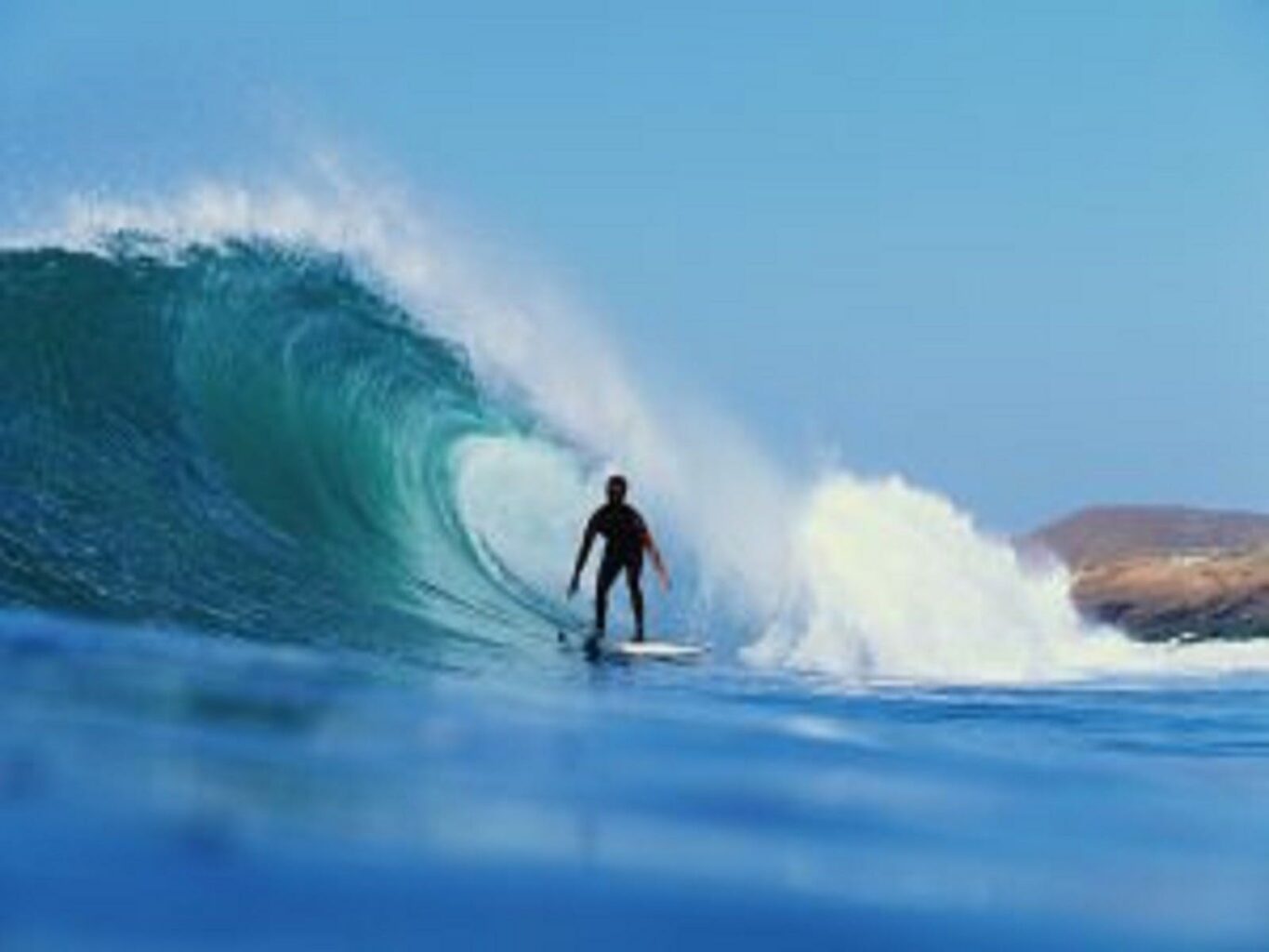 East Coast Surf School - riding a wave.