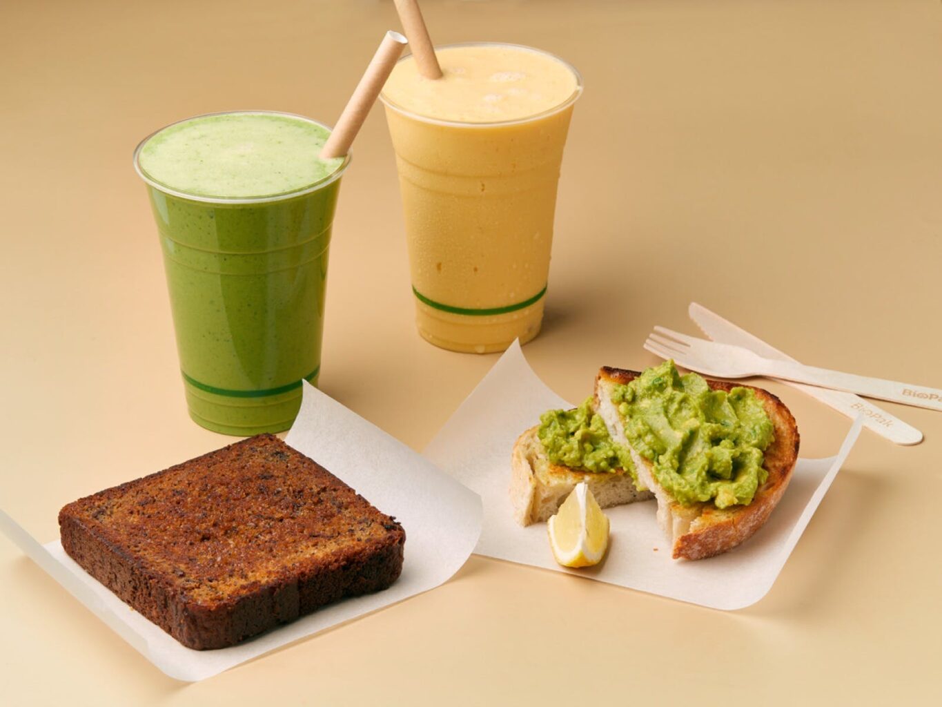 Oliver's banana bread and avocado on sourdough, with green smoothie and mango smoothie