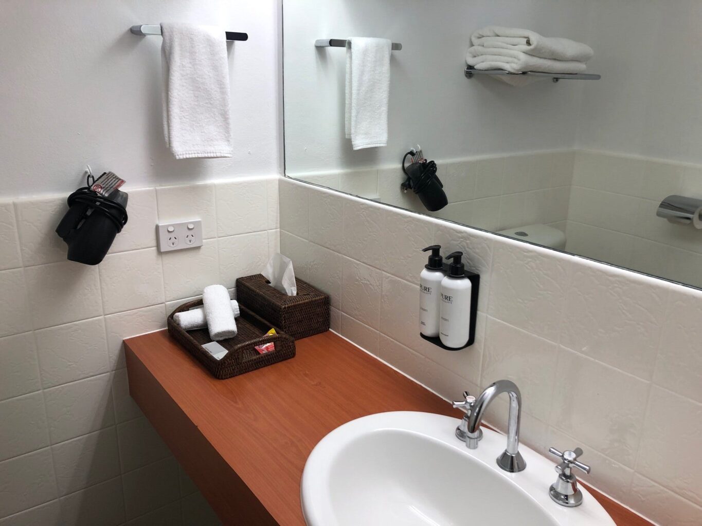 Bathroom with amenities and hairdryer