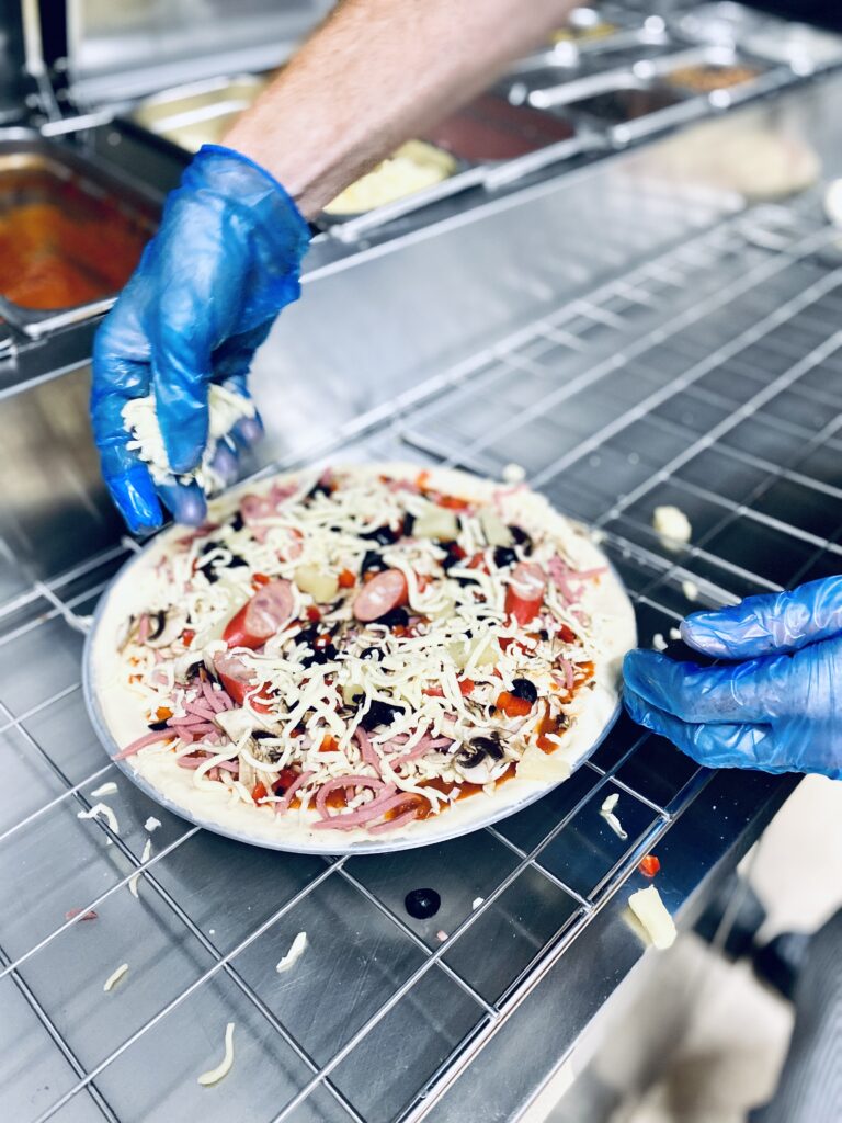 fresh pizza being made