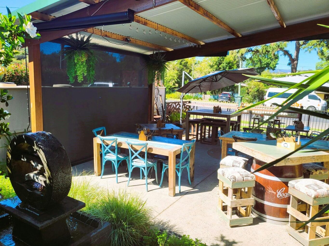 Undercover dining in the courtyard with garden and water feature.  Dog friendly seating.
