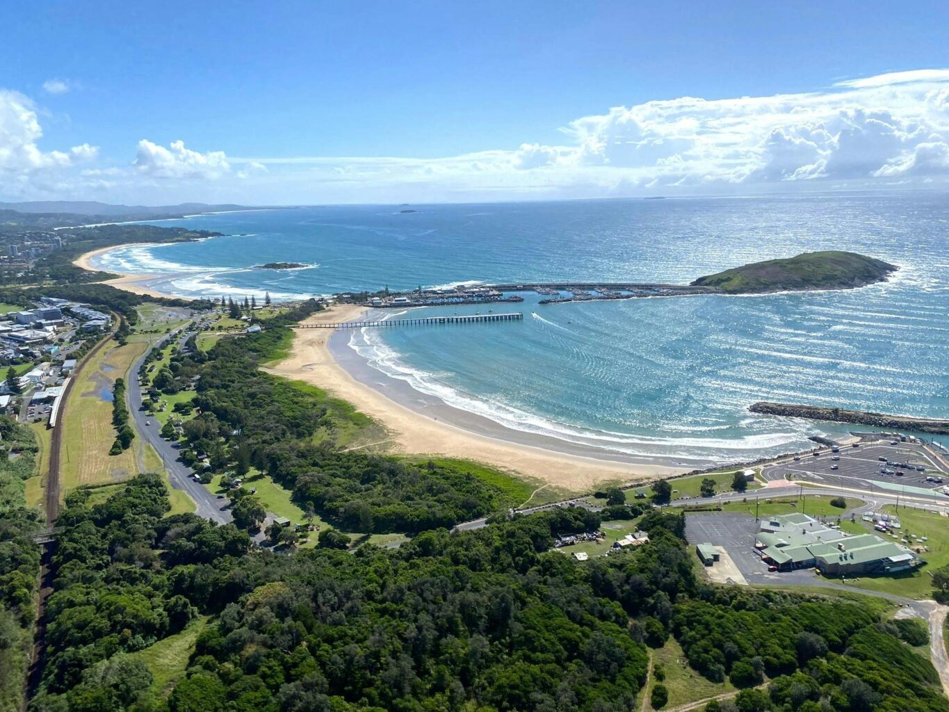 Aerial view of the beautiful Coffs Harbour coastline, Harbour, Jetty & Muttonbird island.