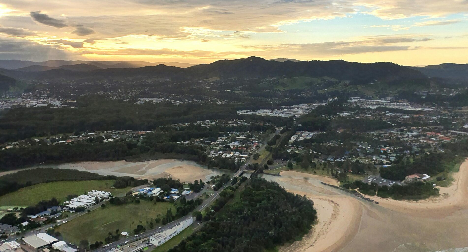 Sunset with ranges in the background overlooking Coffs Harbour, taken from a Helicopter